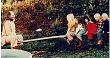 Swami on seesaw with children