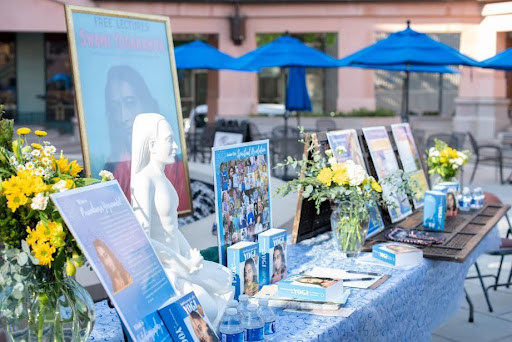Booth with copies of Autobiography of a Yogi and related pictures