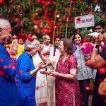 Making Permanent Gains Yogananda New Years quotes by Jyotish and Devi upon arrival in Bangalore flowers and rose petals welcome