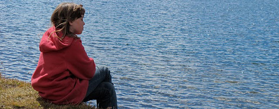 Child-meditating-by-a-lake