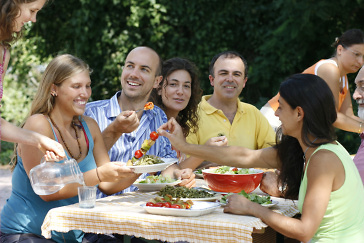 Group of friends eating and talking together: example of conscious state