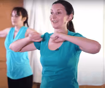 Yoga instructor Melody teaching an Energization Exercise