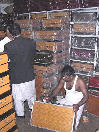 Stacks of harmoniums in the Bina Musical Instruments store, Delhi, India.